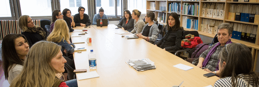 Photograph of a meeting of the wobio group, showing a discussion group of 14 women scientists